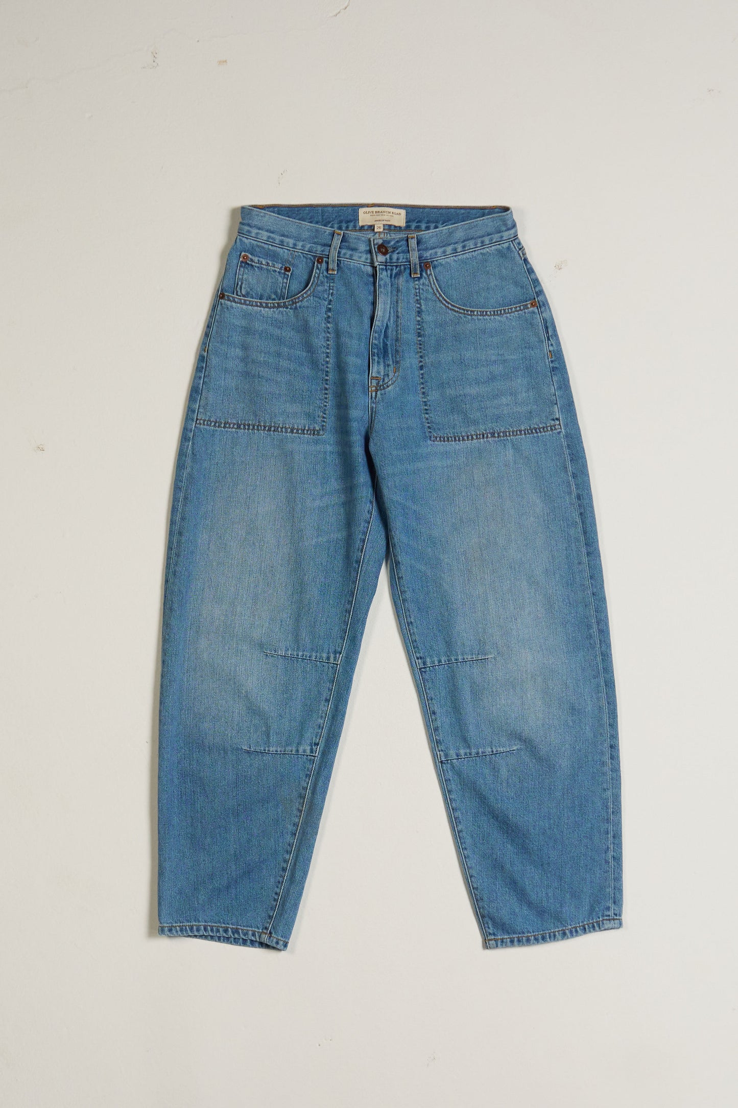 High-waisted, Relaxed barrel leg Blue jeans on a white background